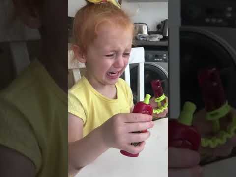 kid struggles with sour sucker