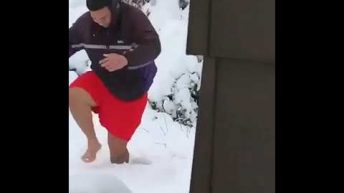 man slips after throwing snowbal