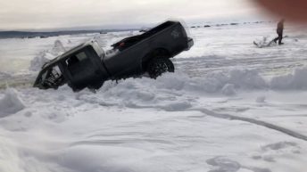 truck sinks through ice on lake