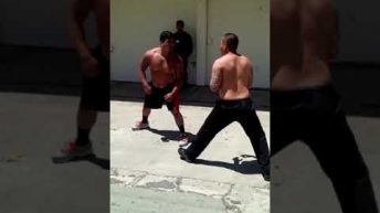 two cholos fight in back alley