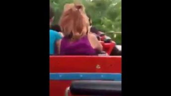 woman wig falls off on rollercoa