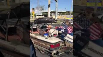 guy drives a boat on the highway