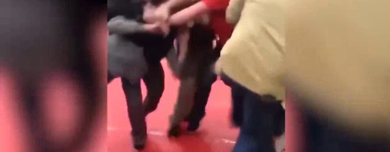 parents fight at wrestling match