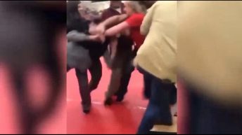 parents fight at wrestling match