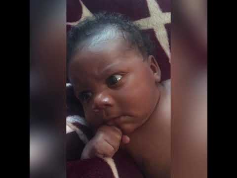 father gives crying baby a taste