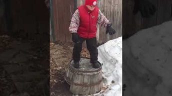 kid breaks barrell and falls in