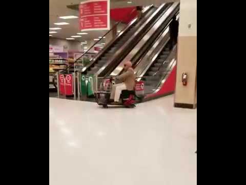 old man tries to ride escalator