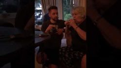 grandma takes a shot of tequila