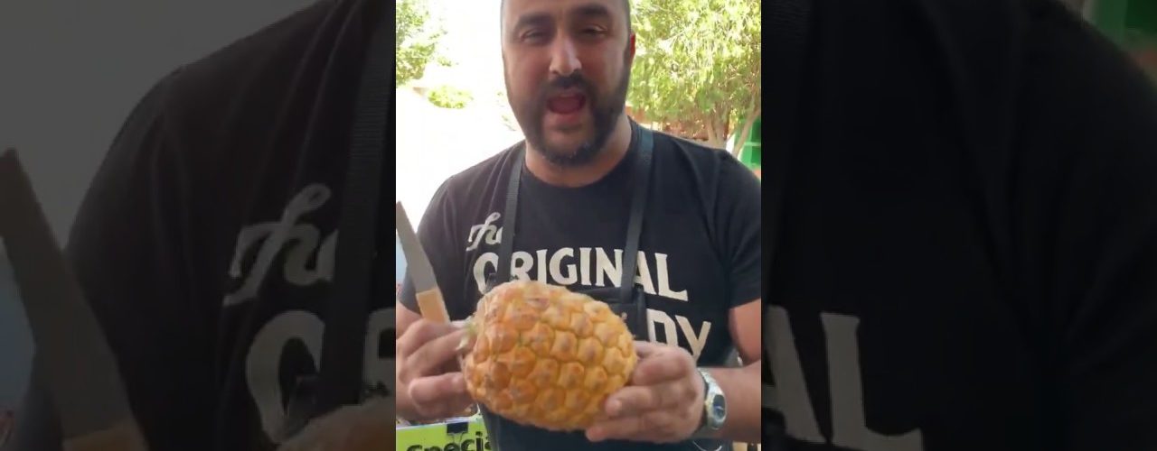 man cuts a pineapple like a pro