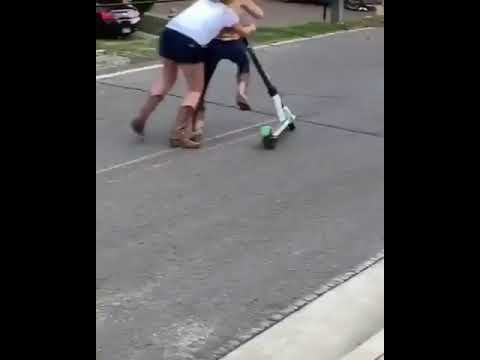 two girls have a scooter riding
