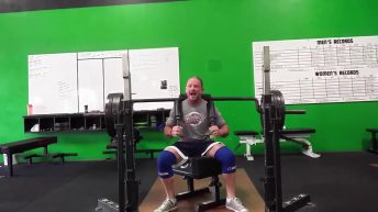 a man gets stuck lifting weights