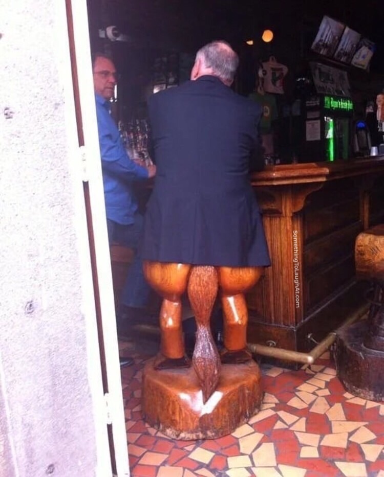 Man sitting on horse bar stool
