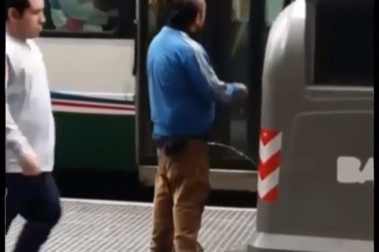 man pees in public