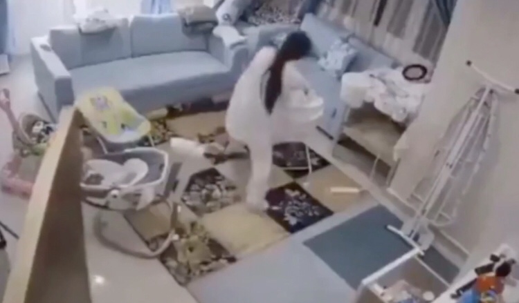 Mom saves child from falling ceiling