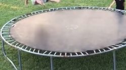 man flips off of trampoline