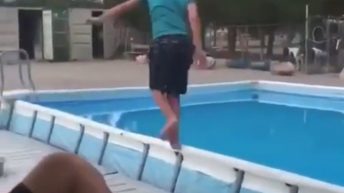 boy falls into pool
