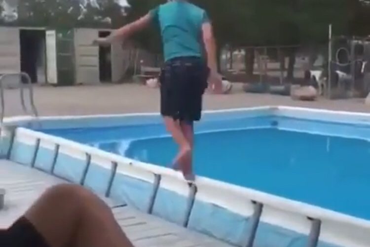 boy falls into pool