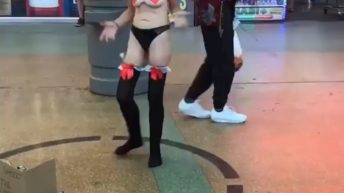 Woman twerks in the middle of shopping strip