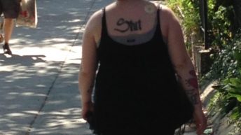 What does her tattoo say?