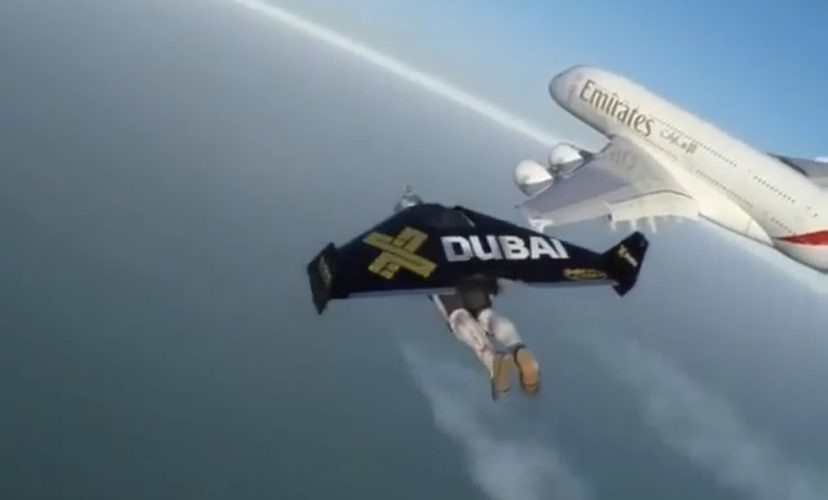Man flies jetpack beside plane in Dubai