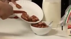 man eats hot dogs like cereal milk