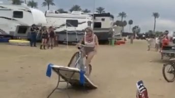 woman crashes bike on table