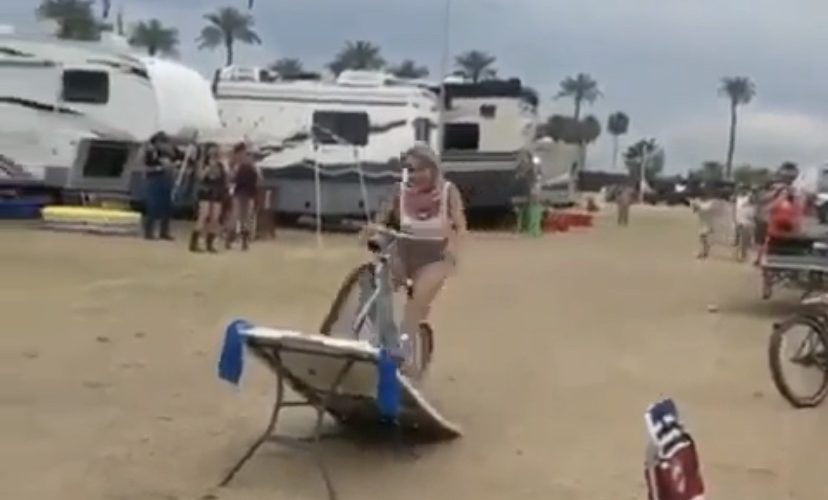 woman crashes bike on table