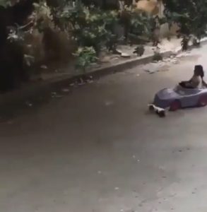 Girl toy car wipeout
