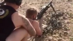 man shoots gun naked