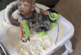 baby playing in flour