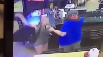 Unbothered man knocks woman out in bar