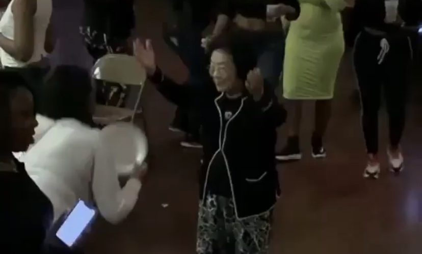 old asian woman dancing