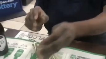 Woman throws money at clerk