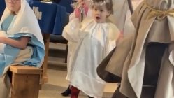 child dancing while in Christmas play