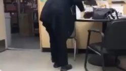 woman caught in office licking cake