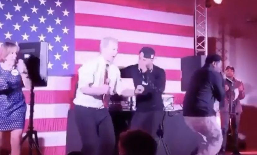 Presidential candidate Tom Steyer performs with rapper Juvenile