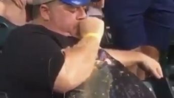 Drunk man throws up in baseball stadium stands