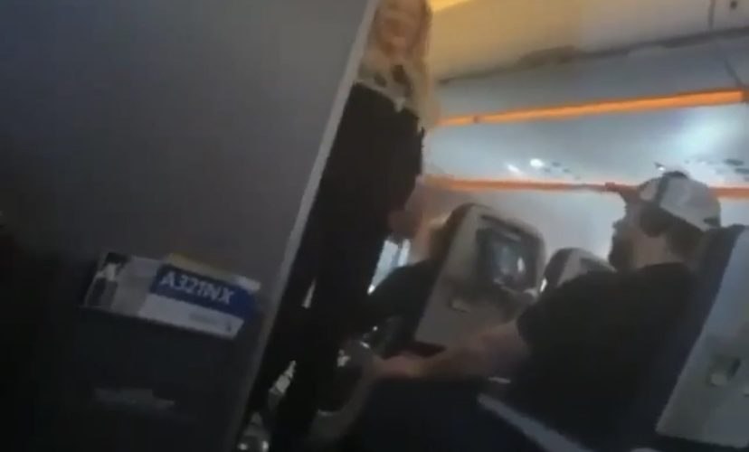 Woman dances on airplane mid flight