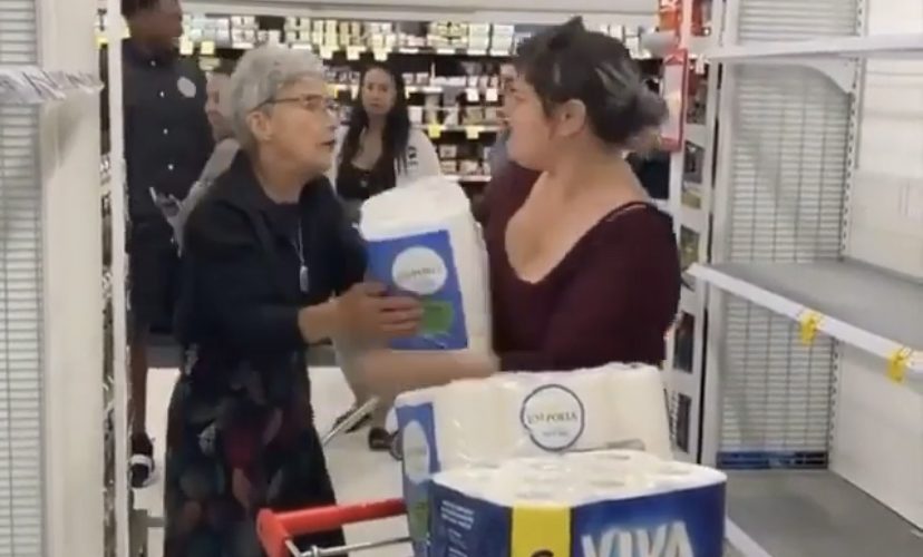 Women argue over the last pack of tissue in a store