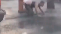 Man wipes on fire hydrant
