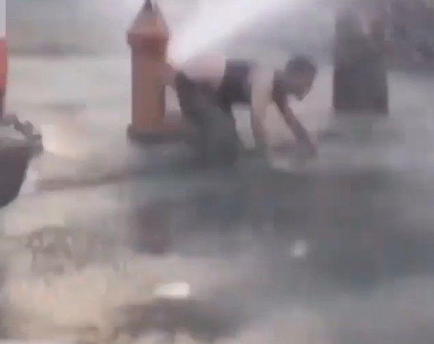 Man wipes on fire hydrant