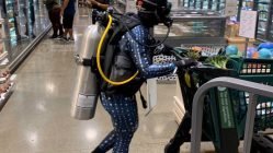 Woman shopping with scuba diving suit on