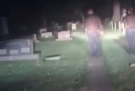 Cops run from graveyard scream