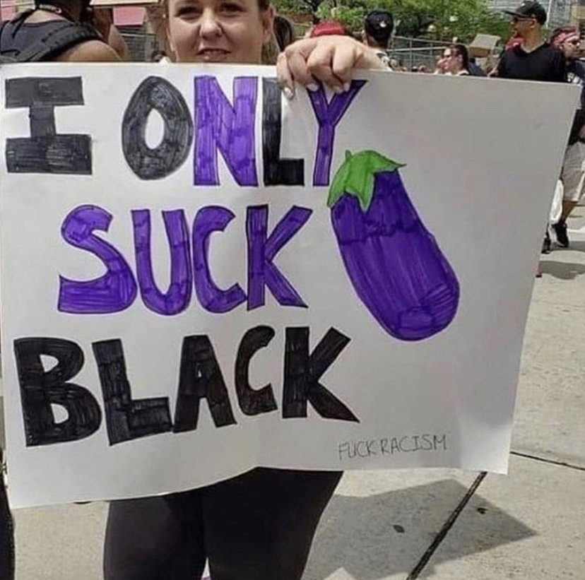 I only suck black protest sign