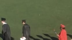 Girl wears heels during graduation
