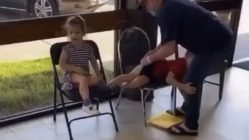 Man disciplines children in public