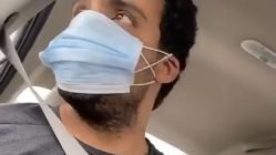 Man shows how to eat with coronavirus mask