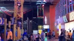 Man flies down indoor zipline