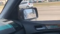 Guy drives over plastic dividers on highway