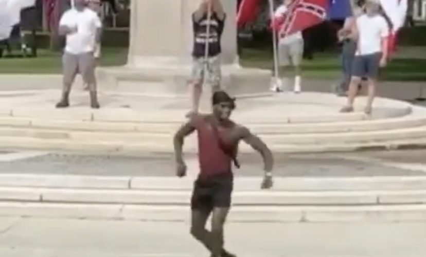 Man dances in front of protestors